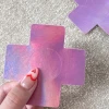 Naughty Thoughts Cross Pasties (5 Pairs) - Holographic Pink